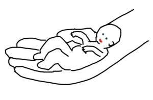 Liten bebis i hand